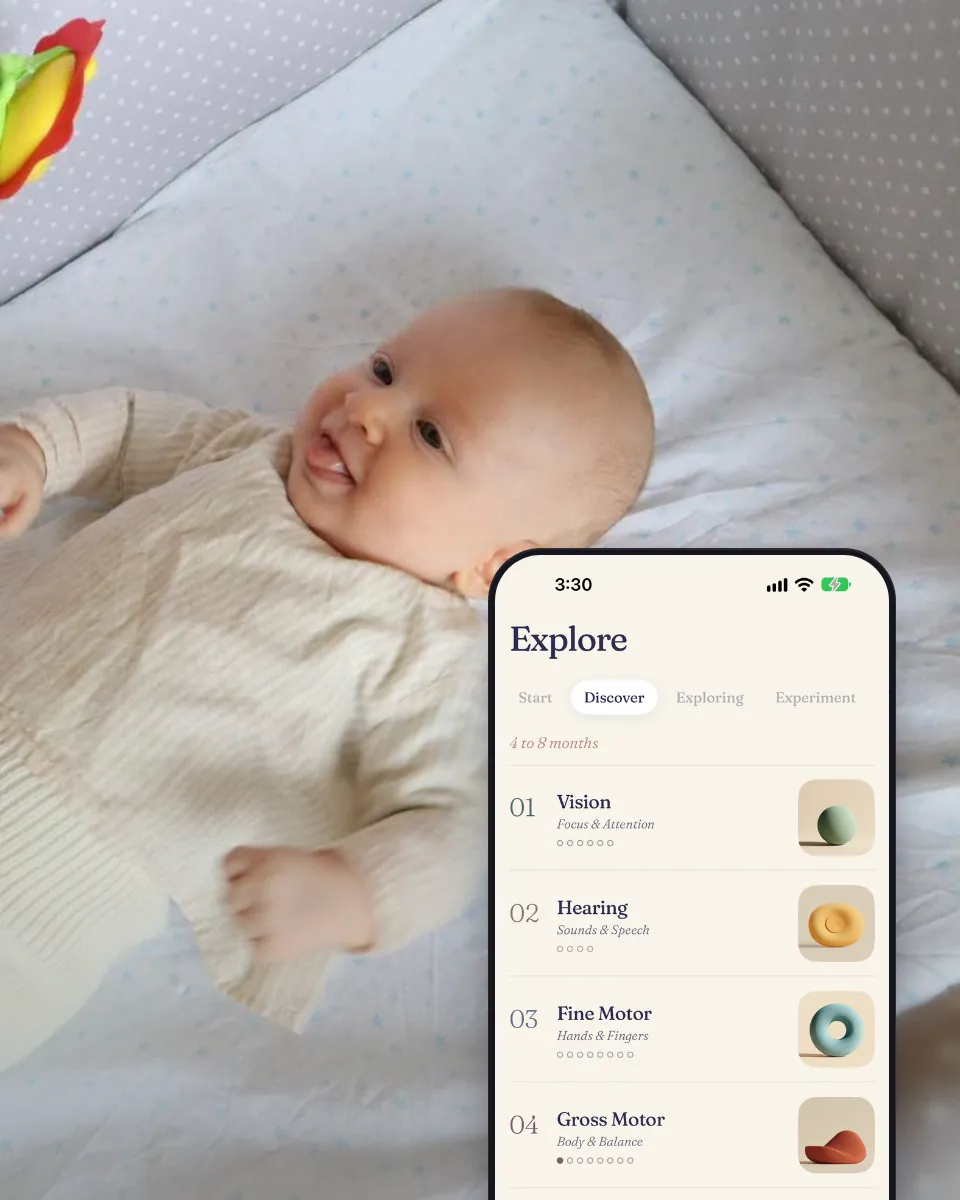 A baby in a crib looks at a rattle, next to the Explore screen with the activity areas.